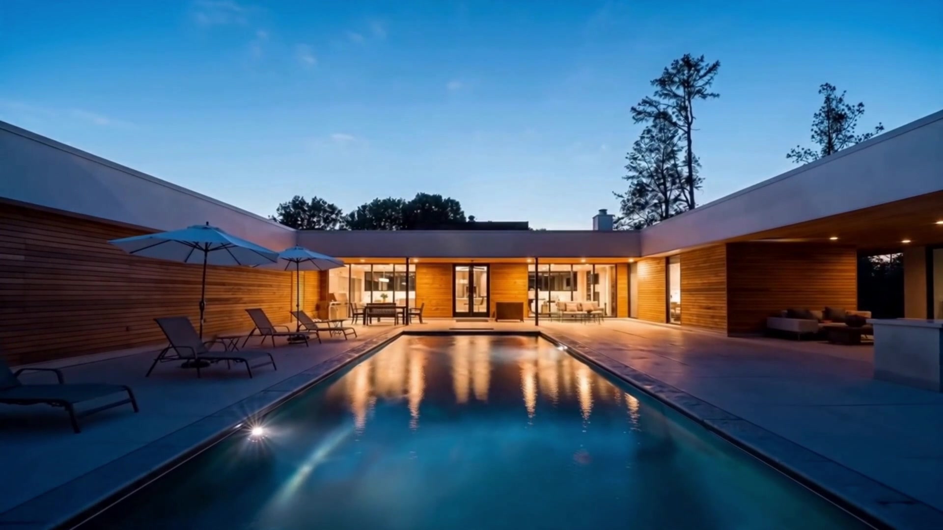 Pool with waterfall and fire features at twilight in Nashville, TN