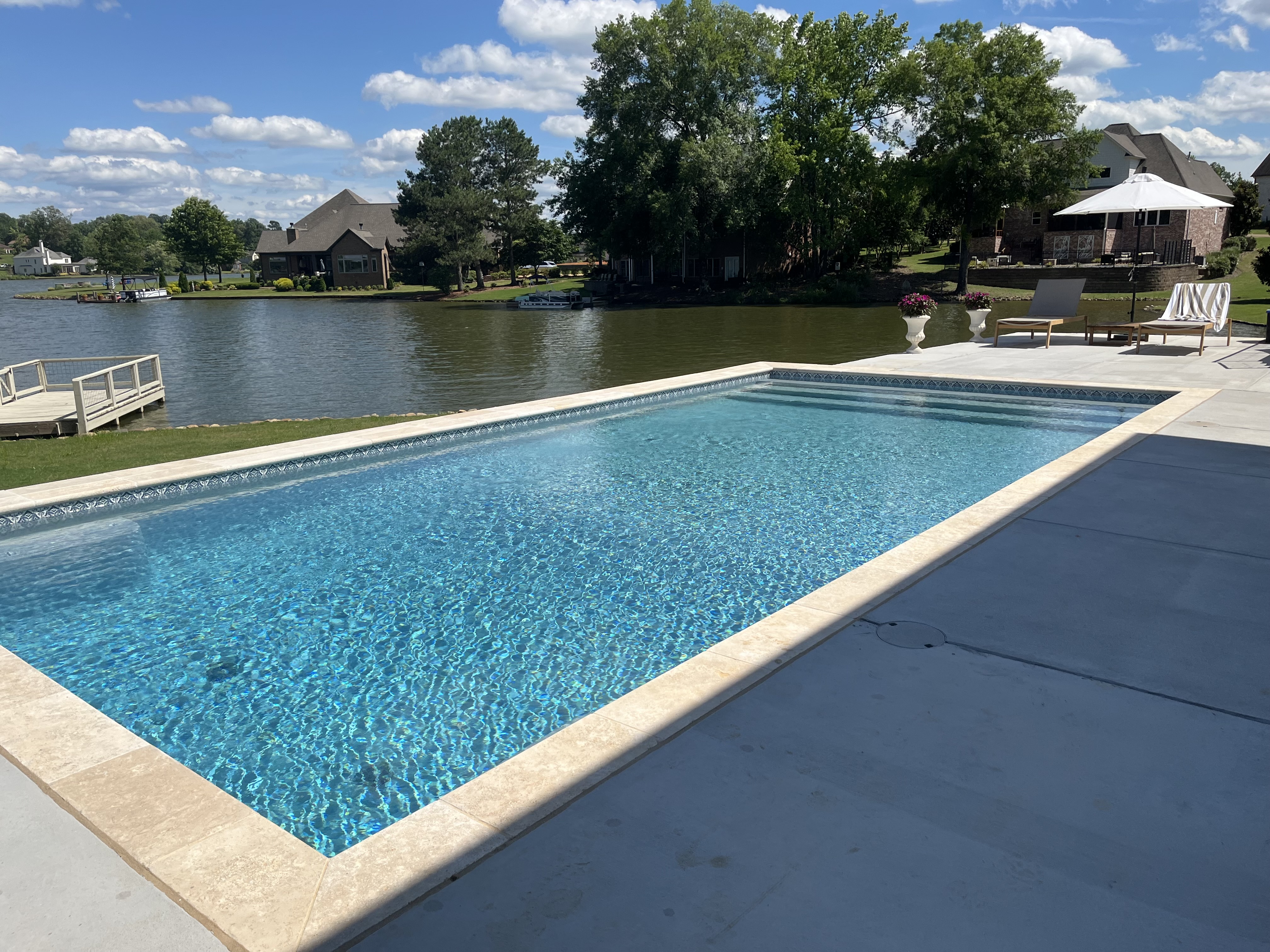 Travertine coping lakefront renovation — Columbia, TN